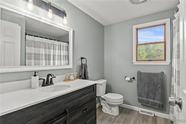 1621 Cain Rd, Brant, NY 14111 - full bathroom featuring vanity, toilet, wood finished floors, and baseboards