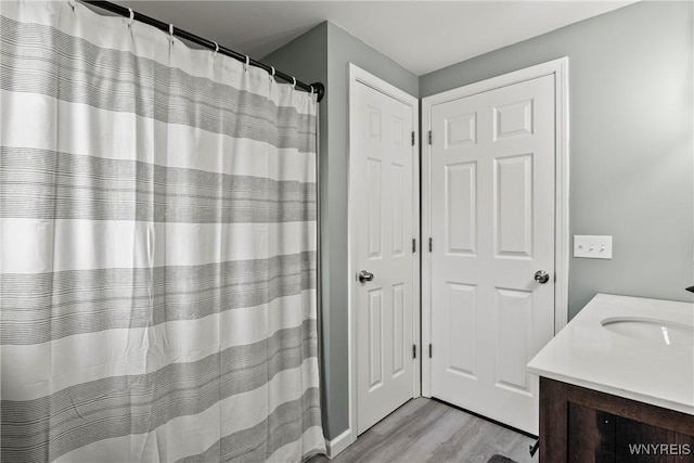 1621 Cain Rd, Brant, NY 14111 - full bathroom featuring wood finished floors, vanity, and curtained shower