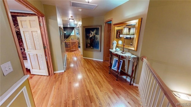 3248 Lockport Olcott Rd, Newfane, NY 14108 - corridor with an upstairs landing, light wood-style floors, and baseboards
