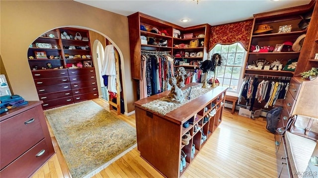 3248 Lockport Olcott Rd, Newfane, NY 14108 - walk in closet featuring wood finished floors and arched walkways