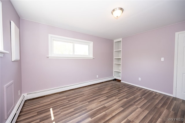 6817 Revere Dr, Evans, NY 14047 - unfurnished room with baseboard heating and dark wood-style floors