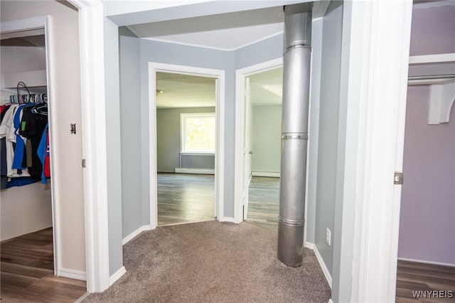 6817 Revere Dr, Evans, NY 14047 - corridor featuring a baseboard radiator, wood finished floors, carpet floors, and ornamental molding