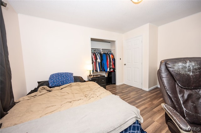 6817 Revere Dr, Evans, NY 14047 - bedroom featuring dark wood finished floors and a closet