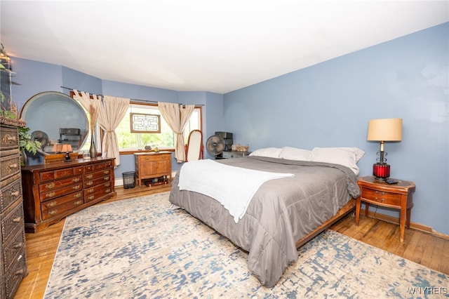 6817 Revere Dr, Evans, NY 14047 - bedroom with wood finished floors