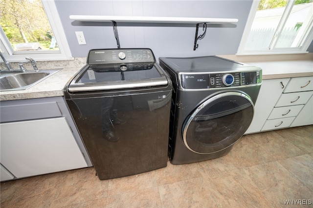 6817 Revere Dr, Evans, NY 14047 - laundry room with cabinet space and independent washer and dryer