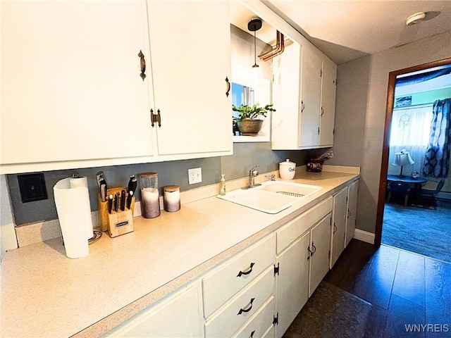 6817 Revere Dr, Evans, NY 14047 - kitchen featuring light countertops and white cabinetry