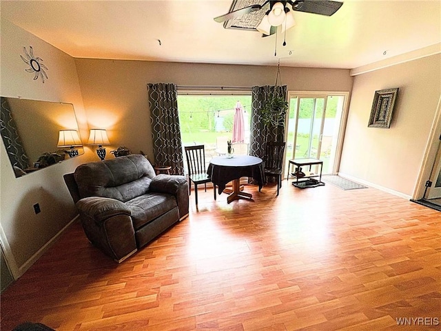 6817 Revere Dr, Evans, NY 14047 - living room with ceiling fan and light wood-style floors