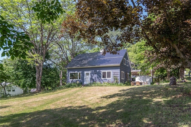 435 Elm St, Ithaca City, NY 14850 - back of house featuring a yard and metal roof