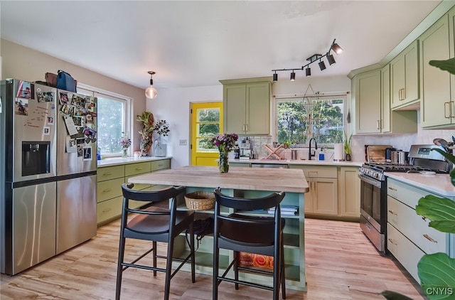 435 Elm St, Ithaca City, NY 14850 - kitchen with stainless steel appliances, green cabinetry, and plenty of natural light