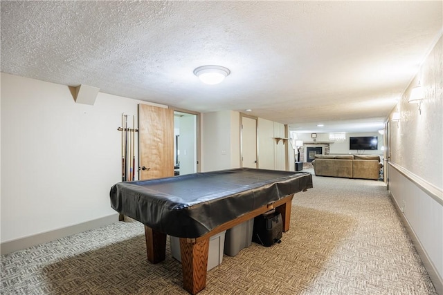 654 Lake Shore Blvd, Irondequoit, NY 14617 - rec room with a fireplace, light colored carpet, billiards, a textured ceiling, and baseboards