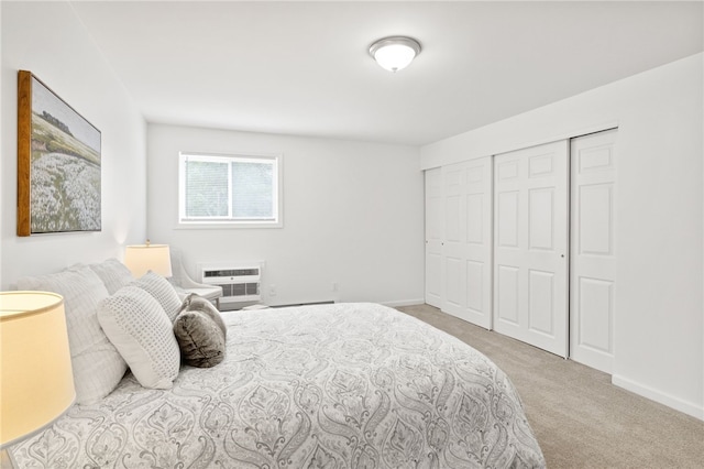406 Westage At The Hbr, Irondequoit, NY 14617 - carpeted bedroom featuring a wall unit AC, a closet, and baseboards