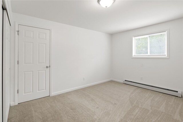406 Westage At The Hbr, Irondequoit, NY 14617 - empty room with baseboard heating, carpet floors, and baseboards