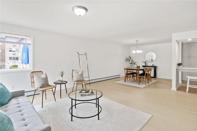 406 Westage At The Hbr, Irondequoit, NY 14617 - living room with a baseboard radiator, a chandelier, light wood-style flooring, and baseboards