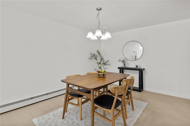 406 Westage At The Hbr, Irondequoit, NY 14617 - dining room featuring a baseboard radiator, a chandelier, and baseboards