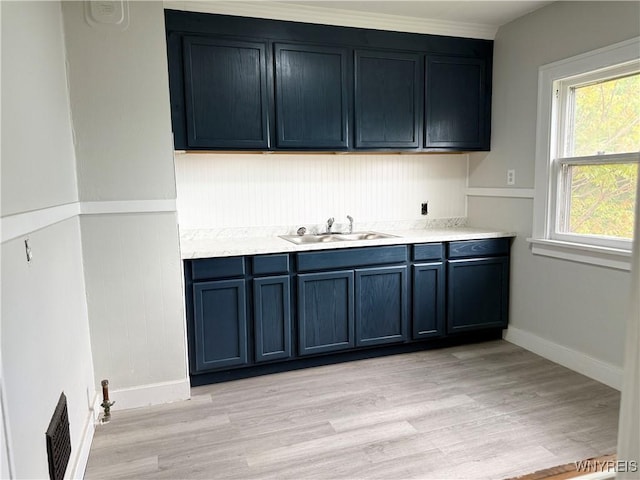711 W Ave, Buffalo, NY 14213 - bar with a sink, light wood-style floors, and baseboards