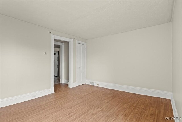 89 Pine St, Lockport-City, NY 14094 - empty room with light wood-style floors and baseboards