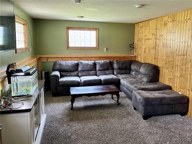 7400 Saint Joseph Rd, Niagara, NY 14304 - carpeted living room featuring plenty of natural light and wood walls