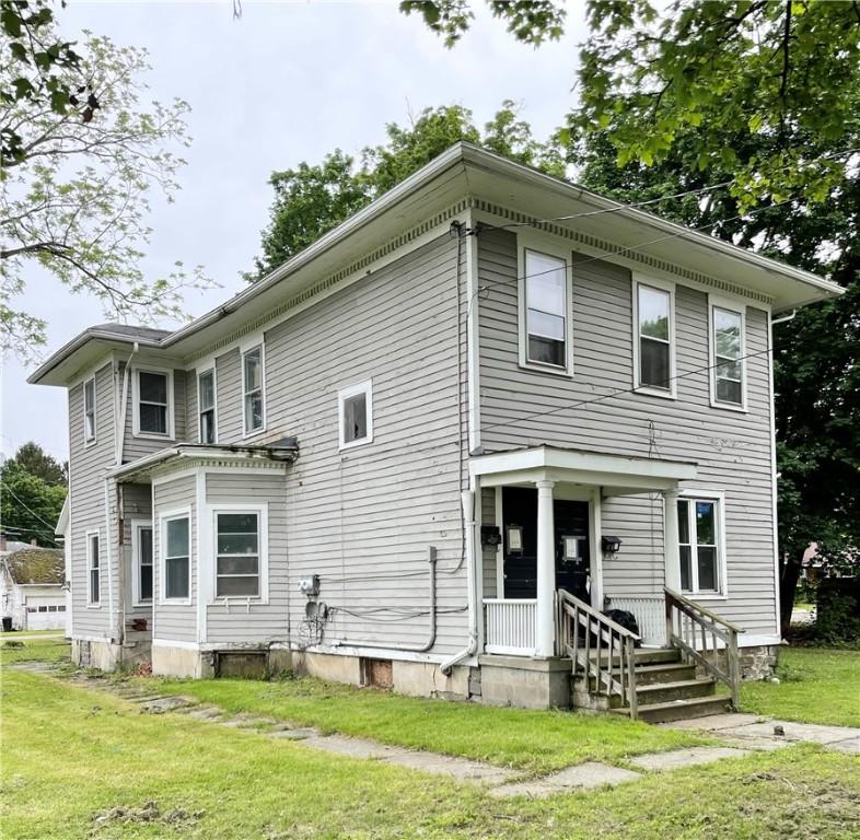 207-209-2091/2 W Chemung Pl, Elmira-City, NY 14904 - view of front facade with a front yard