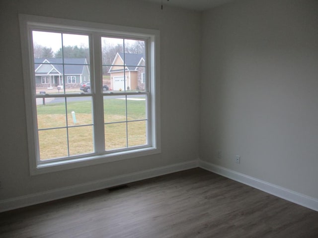 6 Royal Ct, Horseheads, NY 14845 - unfurnished room with dark wood-style flooring and baseboards