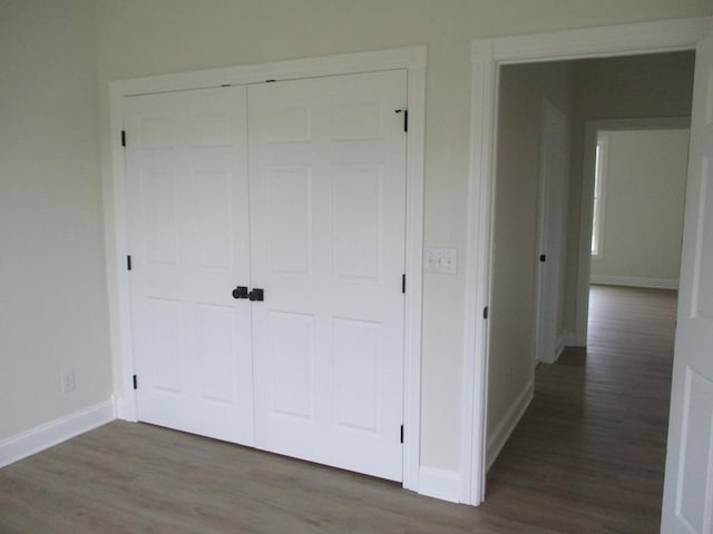 6 Royal Ct, Horseheads, NY 14845 - unfurnished bedroom featuring wood finished floors, baseboards, and a closet