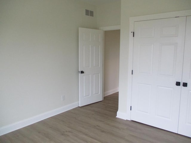 6 Royal Ct, Horseheads, NY 14845 - unfurnished bedroom featuring wood finished floors and a closet