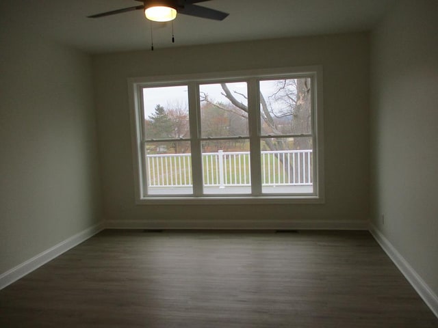 6 Royal Ct, Horseheads, NY 14845 - spare room with healthy amount of natural light, a ceiling fan, and dark wood-style floors