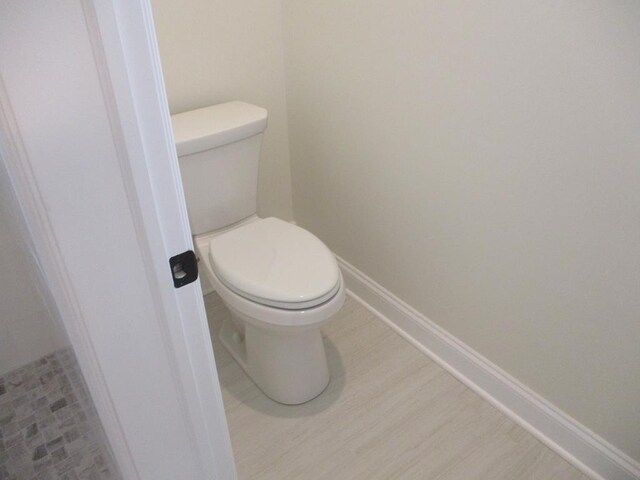 6 Royal Ct, Horseheads, NY 14845 - bathroom featuring toilet and baseboards