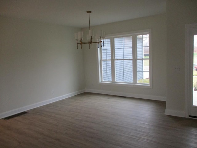 6 Royal Ct, Horseheads, NY 14845 - unfurnished dining area with a chandelier, plenty of natural light, and dark wood-style flooring