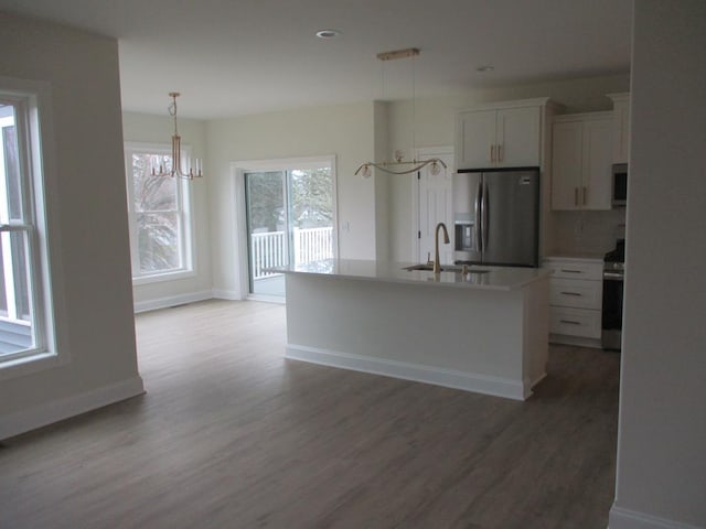 6 Royal Ct, Horseheads, NY 14845 - kitchen with appliances with stainless steel finishes, a sink, white cabinetry, light wood-style floors, and light countertops