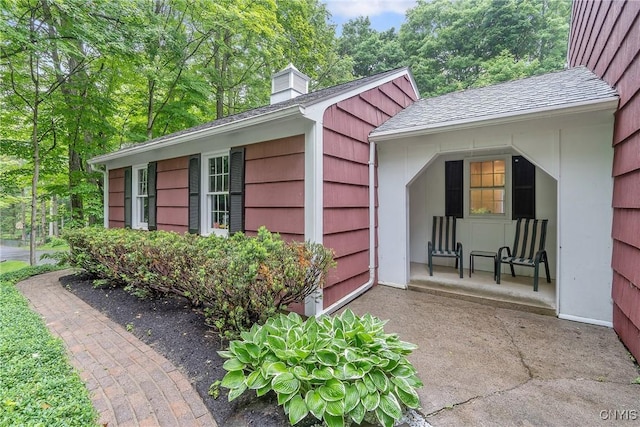 223 Windcrest Dr, Camillus, NY 13031 - view of property exterior featuring a chimney