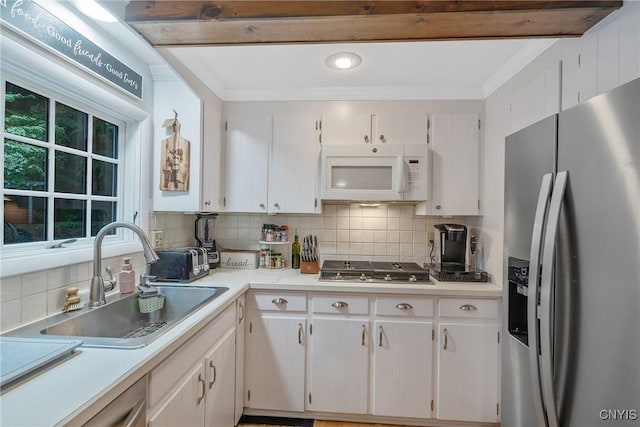 223 Windcrest Dr, Camillus, NY 13031 - kitchen with appliances with stainless steel finishes, light countertops, white cabinetry, decorative backsplash, and ornamental molding