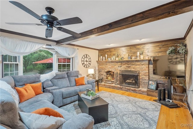 223 Windcrest Dr, Camillus, NY 13031 - living room with wood finished floors, a ceiling fan, a fireplace, beam ceiling, and ornamental molding
