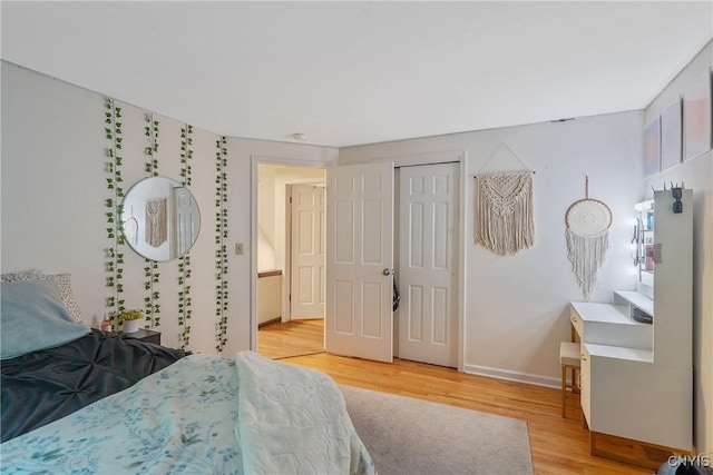 223 Windcrest Dr, Camillus, NY 13031 - bedroom featuring light wood-type flooring and a closet