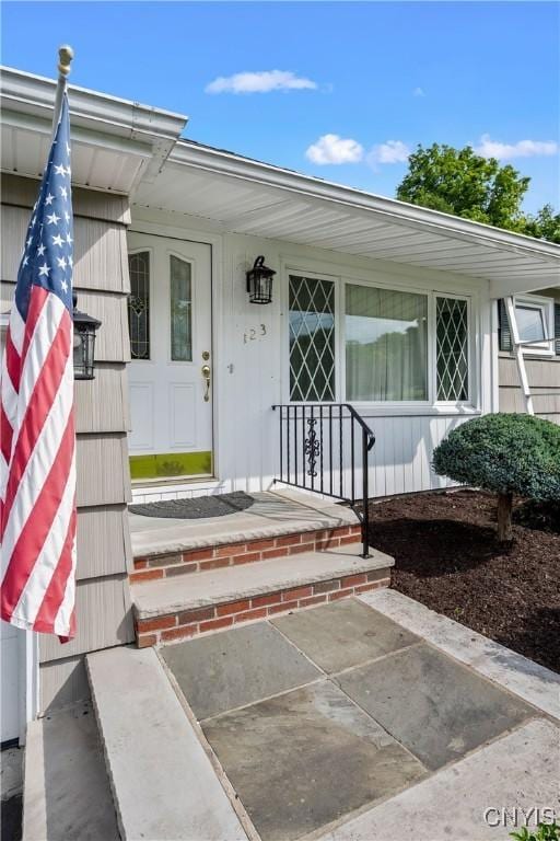123 Hillcrest Rd, Onondaga, NY 13219 - view of exterior entry with a porch
