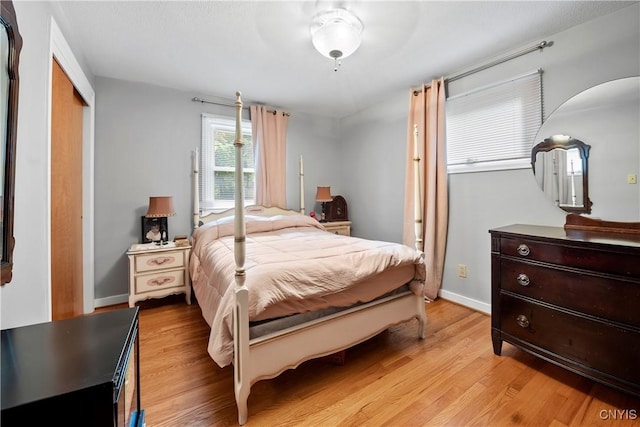 123 Hillcrest Rd, Onondaga, NY 13219 - bedroom with light wood-type flooring, a closet, and baseboards
