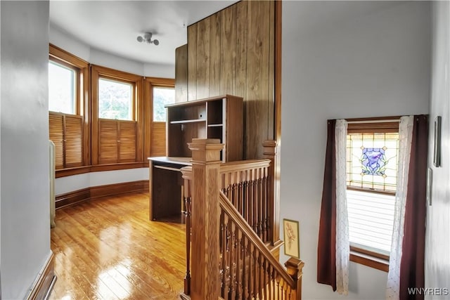 87 Burch Ave, West Seneca, NY 14210 - hallway with an upstairs landing, light wood-style flooring, and baseboards