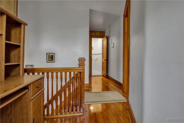 87 Burch Ave, West Seneca, NY 14210 - corridor featuring an upstairs landing, wood finished floors, and baseboards