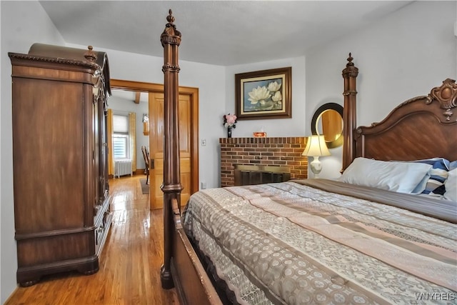 87 Burch Ave, West Seneca, NY 14210 - bedroom with radiator heating unit and light wood-type flooring