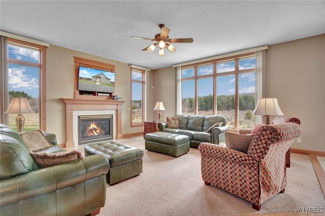 8770 Old State Rd, Allen, NY 14709 - carpeted living area featuring a ceiling fan, a glass covered fireplace, and baseboards