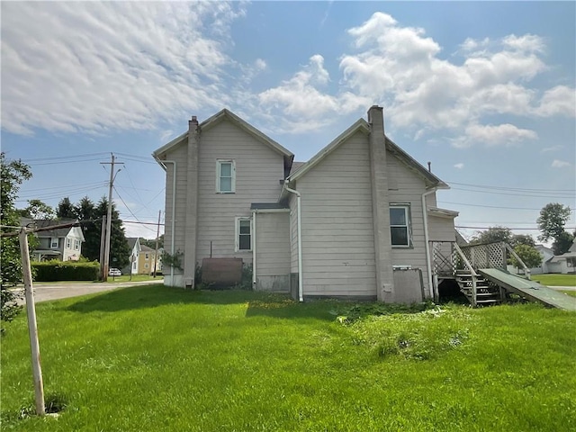 201 S Main St, Wayland, NY 14572 - back of house with a yard and a chimney
