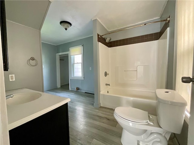 201 S Main St, Wayland, NY 14572 - bathroom featuring toilet, vanity, wood finished floors, and bathing tub / shower combination