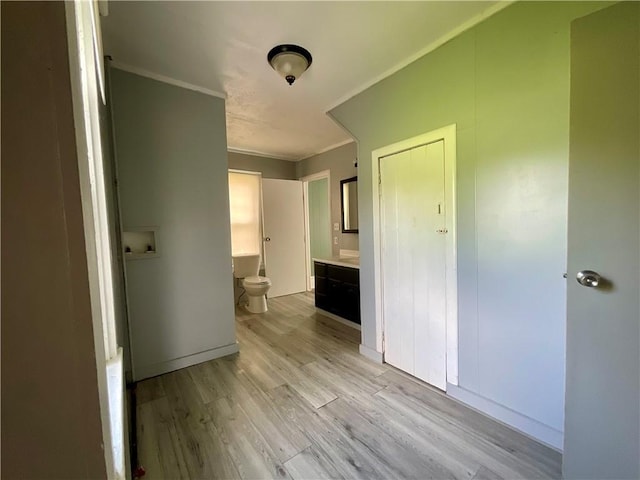 201 S Main St, Wayland, NY 14572 - unfurnished bedroom with light wood-style flooring, connected bathroom, ornamental molding, and baseboards
