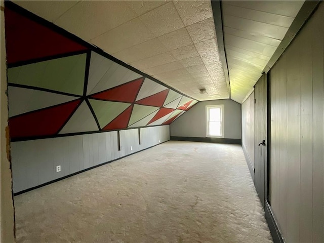 201 S Main St, Wayland, NY 14572 - bonus room featuring lofted ceiling, carpet, and wood walls