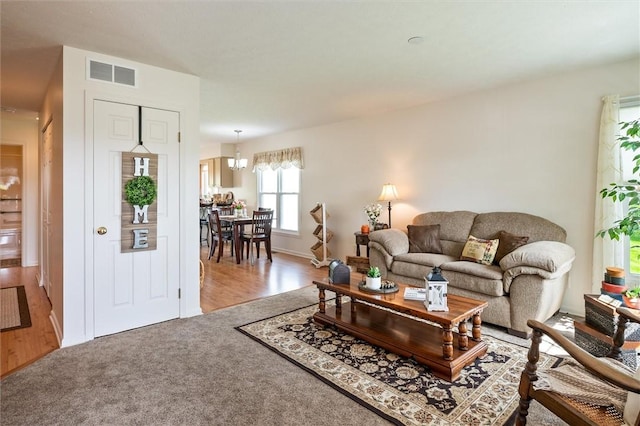 14 Glenn Hvn, Ogden, NY 14559 - carpeted living room featuring baseboards and wood finished floors