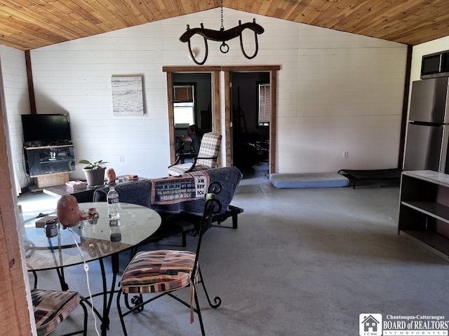 1727 Rte 426, French Creek, NY 14724 - dining area with lofted ceiling, finished concrete floors, wood ceiling, and wooden walls