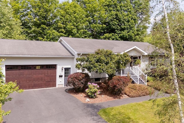26 Prospect St, Delhi, NY 13753 - obstructed view of property with an attached garage and driveway
