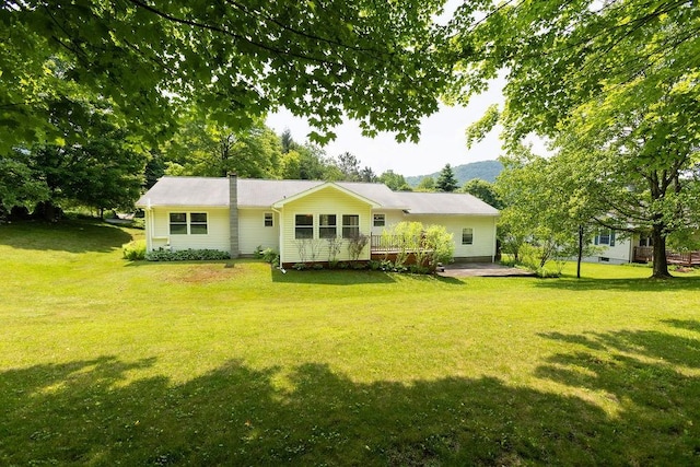 26 Prospect St, Delhi, NY 13753 - back of property with a lawn and a mountain view
