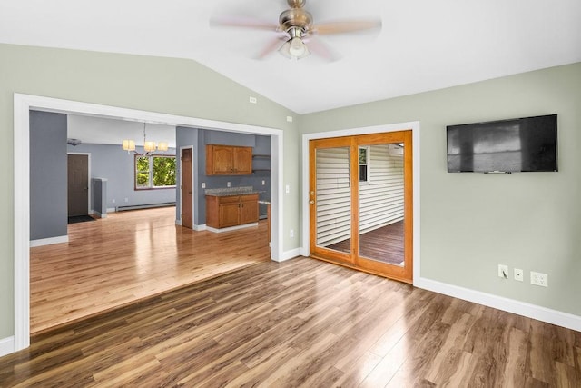 26 Prospect St, Delhi, NY 13753 - unfurnished living room with baseboard heating, lofted ceiling, a chandelier, ceiling fan, and wood finished floors