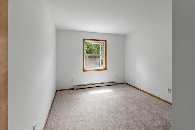 26 Prospect St, Delhi, NY 13753 - carpeted empty room featuring a baseboard heating unit and baseboards