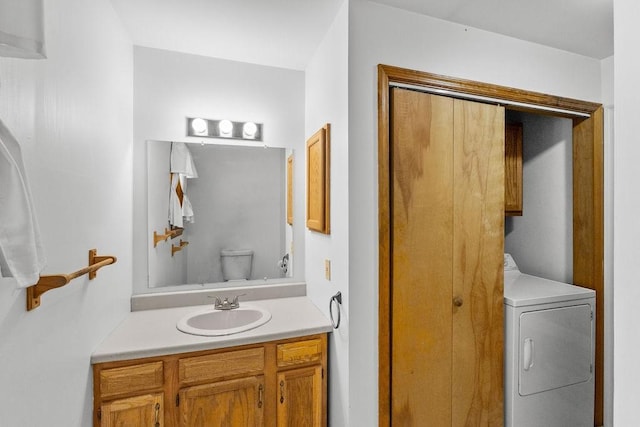 26 Prospect St, Delhi, NY 13753 - half bathroom featuring washer / clothes dryer, toilet, and vanity